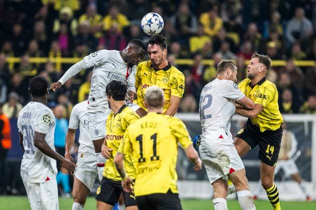 Dortmund, Signal Iduna Park, 04 10 23 Mats Hummels of Dortmund R jumps for a header during the championsleague match between Borussia Dortmund vs AC Milan
