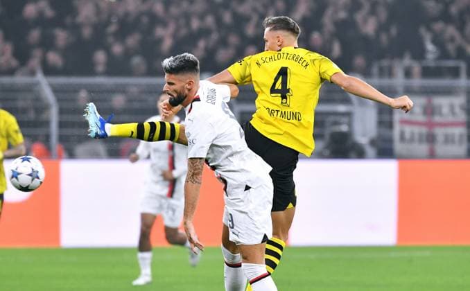 Football, Champions League, Germany, Men, Season 2023 2024, Matchday 2, Signal Iduna Park Dortmund Bor Dortmund AC Milan Nico Schlotterbeck BVB , Olivier Giroud ACM Action UEFA REGULATES PROHIBIT ANY USE OF PHOTOGRAPHS AS IMAGE SEQUENCES AND OR QUASI VIDEO