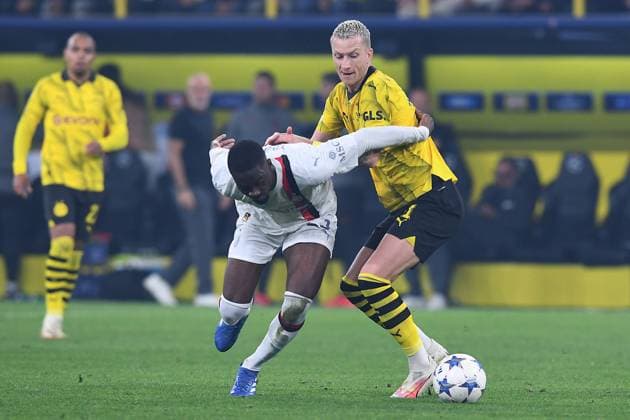 Soccer Champions Group Stage 2 matchday Borussia Dortmund AC Milan on 04 10 2023 at Signal Iduna Park in Dortmund Fikayo Tomori Milan , front Marco Reus Dortmund , back xRx