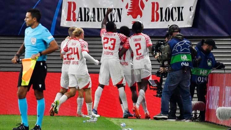 Soccer UEFA Champions League, 2023 2024 season, group stage, matchday 2, RB Leipzig vs Manchester City 04 10 2023 goal scorer Lois Openda center back RB Leipzig, back number 17, 17 center, covers the 1 1 during the match RB Leipzig vs Manchester City 04 10 2023 and cheers with teammates Leipzig Saxony Germany Red Bull Arena