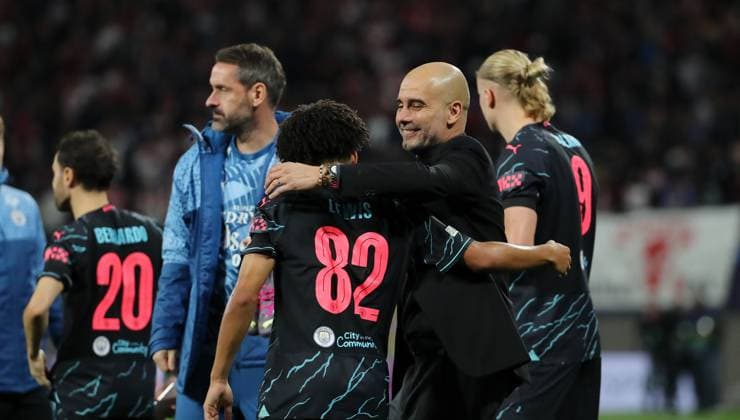 Coach Pep Guardiola cheers with Rico Lewis at the end of the match Sports Football Soccer UEFA Champions League UCL Mens 2 Matchday Season 2023 2024 04 10 2023 Rasen Ballsport RB Leipzig RBL vs Manchester City DFL regulations prohibit any use of photographs as image sequences and or quasi video