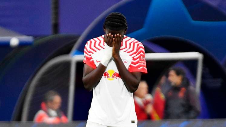 Soccer UEFA Champions League, season 2023 2024, group stage, 2 matchday, RB Leipzig vs Manchester City 04 10 2023 Castello Lukeba center back RB Leipzig, back number 23, 23 holds his hands in front of his face after the match RB Leipzig vs Manchester City 04 10 2023 , he is disappointed Leipzig Saxony Germany Red Bull Arena