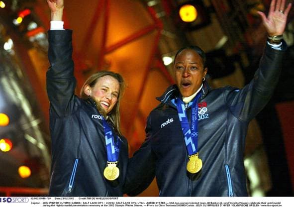 2002 WINTER Olympic Games, Olympische Spiele, Olympia, OS : 2002 WINTER OLYMPIC GAMES : SALT LAKE CITY 2 20 02, SALT LAKE CITY, UTAH, UNITED STATES --- USA two-woman bobsled team Jill Bakken (L) and Vonetta Flowers celebrate their gold medal during the nightly medal presentation ceremony at the 2002 Olympic Winter games, Winterspiele,Spiele, Summer games --- Photo by Chris Trotman DUOMO Corbis JEUX OLYMPIQUES D HIVER OLYMPISCHE SPELEN www.iso be Ogden United States ETATS UNIS VERENIGDE STATEN  Copyright: xTIMxDExWAELEx 56416
