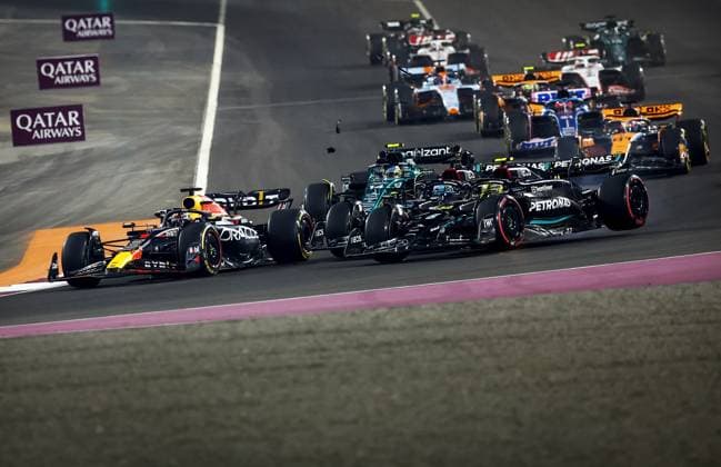 QATAR - Max Verstappen (Red Bull Racing) in action for George Russell (Mercedes) and Lewis Hamilton (Mercedes) during the Formula 1 Grand Prix race at the Lusail International Circuit in Qatar. Max Verstappen became world champion a day earlier during the sprint race. ANP SEM VAN DER WAL Race 2023 2024 xVIxANPxSportx xxANPxIVx 480601219 originalFilename: 480601219.jpg