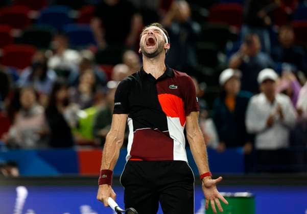 (231011) -- SHANGHAI, Oct. 11, 2023 -- Grigor Dimitrov of Bulgaria jubilates after winning the men s singles round of 16 match between Carlos Alcaraz of Spain and Grigor Dimitrov of Bulgaria at the ATP, Tennis Herren Shanghai Masters tennis tournament in Shanghai, east China, Oct. 11, 2023. ) (SP)CHINA-SHANGHAI-TENNIS-ATP TOUR-SHANGHAI MASTERS(CN) WangxLili 