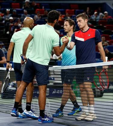 (231012) -- SHANGHAI, Oct. 12, 2023 -- Sadio Doumbia(1st L) Fabien Reboul(2nd L) of France and Wesley Koolhof of the Netherlands Neal Skupski(1st R) of Britain shake hands after their men s doubles quaterfinal at the ATP, Tennis Herren World Tour Shanghai Masters tennis tournament at Qizhong Forest Sports City Arena in Shanghai, east China, Oct. 12, 2023. ) (SP)CHINA-SHANGHAI-TENNIS-ATP TOUR-SHANGHAI MASTERS(CN) WangxLili 