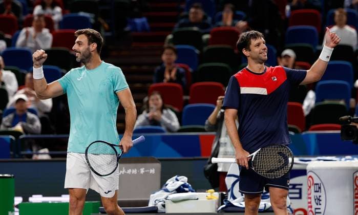(231013) -- SHANGHAI, Oct. 13, 2023 -- Marcel Granollers (L) of Spain Horacio Zeballos of Argentina greet spectators after the men s doubles semifinal between Marcel Granollers of Spain Horacio Zeballos of Argentina and Rinky Hijikata of Australia Cameron Norrie of Britain at the ATP, Tennis Herren World Tour Shanghai Masters tennis tournament at Qizhong Forest Sports City Arena in Shanghai, east China, Oct. 13, 2023. ) (SP)CHINA-SHANGHAI-TENNIS-ATP TOUR-SHANGHAI MASTERS(CN) WangxLili 
