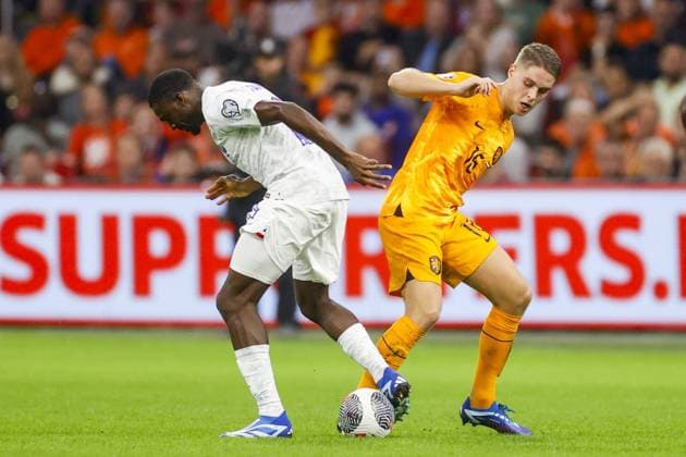 AMSTERDAM, 13-10-2023 JohanCruyff Arena, Football Euro2024 Qualifier between Netherlands and France. Netherlands player Joey Veerman and France player Youssouf Fofana Netherlands - France  x22734653x Copyright: