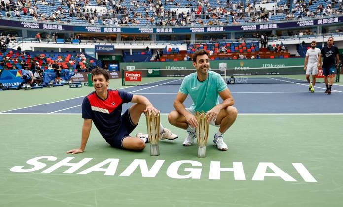 (231015) -- SHANGHAI, Oct. 15, 2023 -- First placed Marcel Granollers (R) of Spain Horacio Zeballos of Argentina pose with their trophies during the awarding ceremony of the men s doubles event at the ATP, Tennis Herren World Tour Shanghai Masters tennis tournament at Qizhong Forest Sports City Arena in Shanghai, east China, Oct. 15, 2023. ) (SP)CHINA-SHANGHAI-TENNIS-ATP TOUR-SHANGHAI MASTERS(CN) WangxLili 
