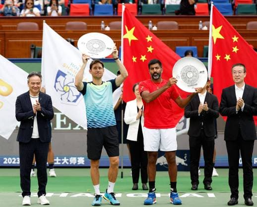 (231015) -- SHANGHAI, Oct. 15, 2023 -- Second placed Rohan Bopanna (front R) of India Matthew Ebden(front L) of Australia pose with their trophies during the awarding ceremony of the men s doubles event at the ATP, Tennis Herren World Tour Shanghai Masters tennis tournament at Qizhong Forest Sports City Arena in Shanghai, east China, Oct. 15, 2023. ) (SP)CHINA-SHANGHAI-TENNIS-ATP TOUR-SHANGHAI MASTERS(CN) WangxLili 