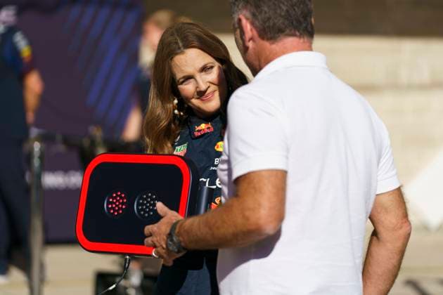 Actress Drew Barrymore speaks with Red Bull Racing team chief Christian Horner in pit lane during the Formula One Grand Prix of the US at the Circuit of The Americas in Austin, Texas, on Thursday, October 19, 2023.  AUS20231019704 GREGxNASH