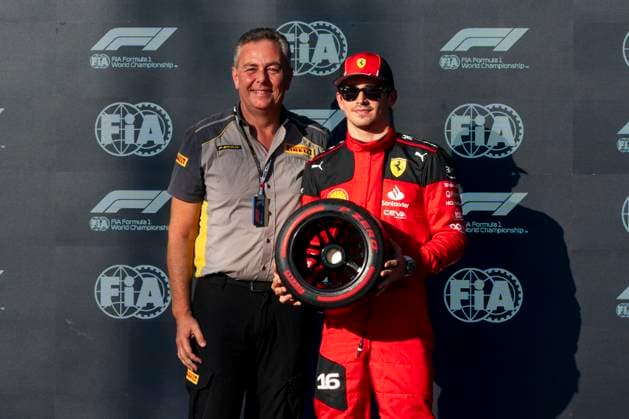 Pirelli Racing Manager Mario Isola and Monaco s Formula One driver Charles Leclerc of Scuderia Ferrari pose with the pole position award following qualifying for the Formula One Grand Prix of the US at the Circuit of The Americas in Austin, Texas, on Friday, October 20, 2023.  AUS20231020210 GREGxNASH