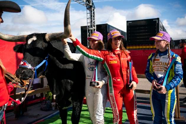 Spanish Formula One Academy driver Nerea Marti of Campos Racing, Spanish Formula One Academy driver Marta Garcia of Prema Racing and British Formula One Academy driver Jessica Edgar of Rodin Carlin take a photo with a longhorn steer following the third Formula One Academy race during the Formula One Grand Prix of the US at the Circuit of The Americas in Austin, Texas, on Sunday, October 22, 2023.  QUS20231022212 GREGxNASH