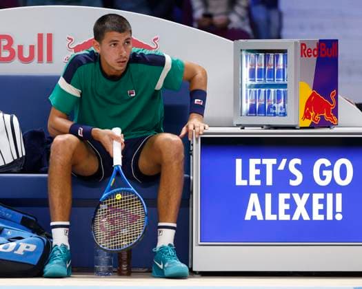 Alexei Popyrin sits on the bench during the break in play Copyright: xJuergenxHasenkopfx