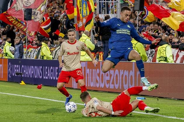 LENS - 24-10-2023, Stade Bollaert-Delelis. Football, Champions League, season 2023-2024. Lens - PSV. Sergino Dest of PSV jump after tackle of Jonathan Gradit of RC Lens Lens - PSV  x22882812x Copyright: