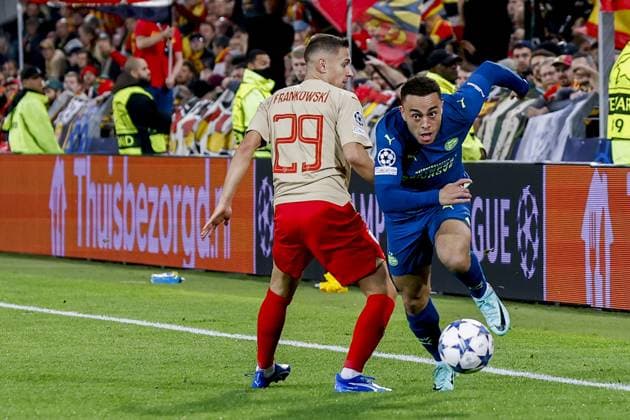 LENS - 24-10-2023, Stade Bollaert-Delelis. Football, Champions League, season 2023-2024. Lens - PSV. PrzemysÅ‚aw Frankowski of RC Lens and Sergino Dest of PSV Lens - PSV  x22882970x Copyright: