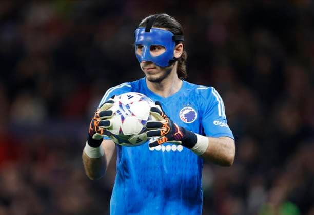 Manchester United, ManU v F.C. Copenhagen: Group A - UEFA Champions League 2023 24 Kamil Grabara goalkeeper of FC Copenhagen wearing mask with the ball during the UEFA Champions League match between Manchester United and F.C. Copenhagen at Old Trafford on October 24, 2023 in Manchester, England. Manchester Old Trafford England United Kingdom Copyright: xRichardxSellers Sportsphoto APLx 13958409