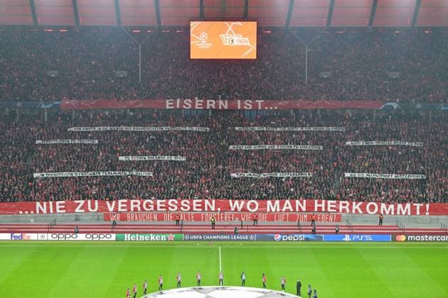 Football, Men, 2023 2024 season, UEFA Champions League Group C, Matchday 3 , 1 FC Union Berlin SSC Napoli, v l The fans of 1 FC Union Berlin with a banner Eisern is ¦ never forget where you come from , 24 10 2023, Copyright: xMatthiasxKochx