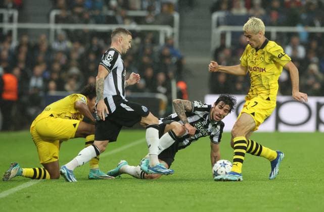 Newcastle Upon Tyne, England, 25th October 2023. Kieran Trippier and Sandro Tonali of Newcastle United in action with Giovanni Reyna of Borussia Dortmund during the UEFA Champions League match at St. James Park, Newcastle Upon Tyne. Picture credit should read: Nigel Roddis Sportimage EDITORIAL USE ONLY. No use with unauthorised audio, video, data, fixture lists, club league logos or live services. Online in-match use limited to 120 images, no video emulation. No use in betting, games or single club league player publications. SPI-2675-0021