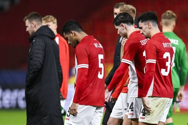 Antwerp s Owen Wijndal, Antwerp s Jurgen Peter Ekkelenkamp and Antwerp s Jelle Bataille look dejected after losing a soccer game between Belgian Royal Antwerp FC and Portuguese FC Porto, Wednesday 25 October 2023 in Antwerp, on day three of the Champions League group stage, in the group H. TOM GOYVAERTS TomxGoyvaerts  x78532592x