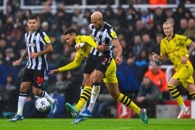 Newcastle United v Borussia Dortmund Champions League 25 10 2023. Joelinton of Newcastle tackles Felix Nmecha of Borussia Dortmund during the UEFA Champions League match between Newcastle United and Borussia Dortmund at St. James Park, Newcastle, England on 25 October 2023. Newcastle St. James Park Tyne and Wear England Editorial use only , Copyright: xMalcolmxMackenziex PSI-18273-0047