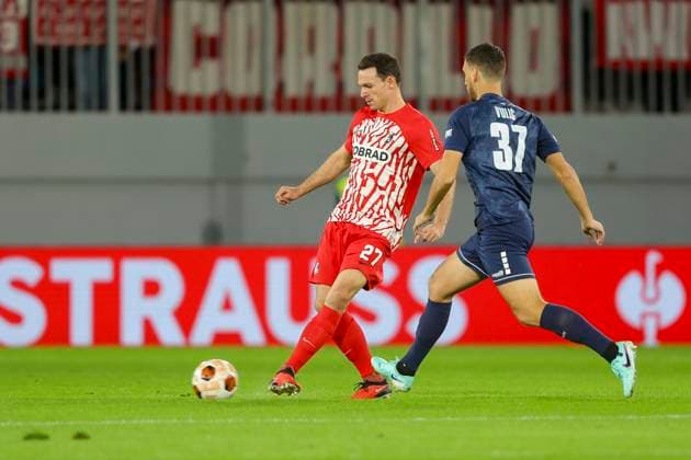 Serbia, Backa Topola, 26 10 2023, , TSC Backa Topola SC Freiburg UEFA Europa League 2023 2024 Group A, Nicolas Hoefler SC Freiburg and Milos Vulic TSC Backa Topola battle for the ball Backa Topola  eu-images-084