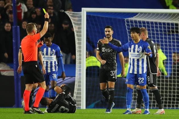 Brighton & Hove Albion v Ajax, Brighton, UK - 26 Oct 2023 Kaoru Mitoma of Brighton & Hove Albion is shown a yellow card by Referee, Bartosz Frankowski during the Europa League match between Brighton & Hove Albion and Ajax at The Amex, Brighton on 26 October 2023 ( Brighton The Amex Brighton England Copyright: xMicahxCrook PPAUKx PPA-064186