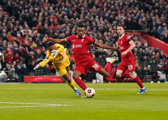 Liverpool, England, 26th October 2023. Ryan Gravenberch of Liverpool rounds Guillaume Restes of Toulouse FC to score their third goal during the UEFA Europa League match at Anfield, Liverpool. Picture credit should read: Andrew Yates Sportimage EDITORIAL USE ONLY. No use with unauthorised audio, video, data, fixture lists, club league logos or live services. Online in-match use limited to 120 images, no video emulation. No use in betting, games or single club league player publications. SPI-2678-0047