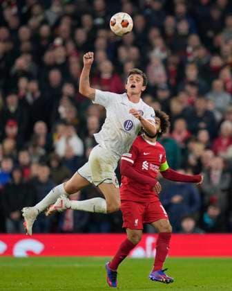 UEFA Europa League Liverpool v Toulouse Rasmus Nicolaisen 2 of Toulouse jumps for a header under pressure from Mohamed Salah 11 of Liverpool during the UEFA Europa League match Liverpool vs Toulouse at Anfield, Liverpool, United Kingdom, 26th October 2023 (Photo by Steve Flynn News Images) Liverpool Anfield Merseyside United Kingdom Copyright: xStevexFlynn NewsxImagesx
