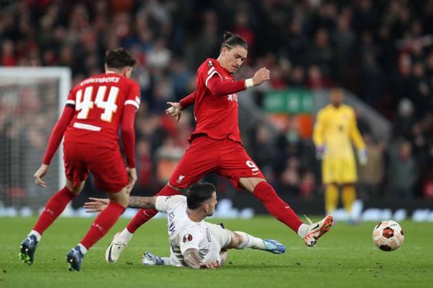 26th October 2023; Anfield, Liverpool, Merseyside, England; Europa League Football, Liverpool versus Toulouse; Darwin Nunez of Liverpool evades a tackle by Aron Donnum of Toulouse  ActionPlus12569359 DavidxBlunsden