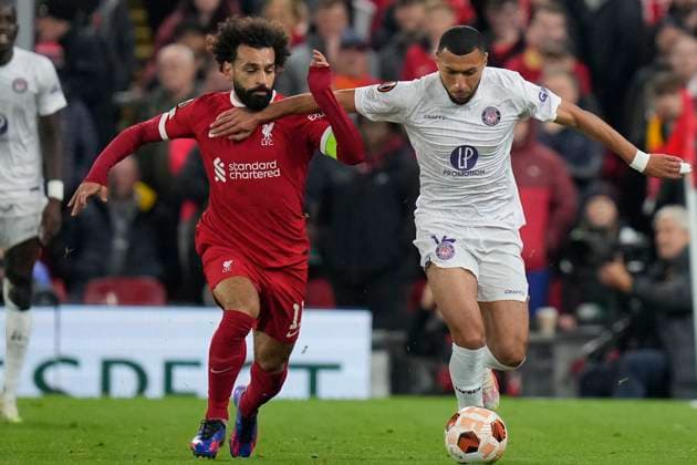 UEFA Europa League Liverpool v Toulouse Yanis Begraoui 14 of Toulouse competes for the ball with Mohamed Salah 11 of Liverpool during the UEFA Europa League match Liverpool vs Toulouse at Anfield, Liverpool, United Kingdom, 26th October 2023 (Photo by Steve Flynn News Images) Liverpool Anfield Merseyside United Kingdom Copyright: xStevexFlynn NewsxImagesx