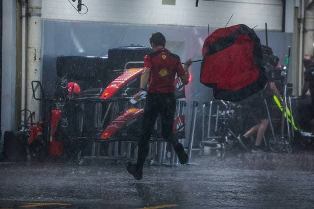 Scuderia Ferrari engineer runs under the storm during the 2023 Formula 1 Rolex Grande Premio de Sao Paulo, 20th round of the 2023 Formula One World Championship, WM, Weltmeisterschaft from November 3 to 5, 2023 on the Autodromo JosÃ Carlos Pace, in Sao Paulo, Brazil - F1 - SAO PAULO GRAND PRIX 2023 DPPI Panoramic  00123044_G0OD0748