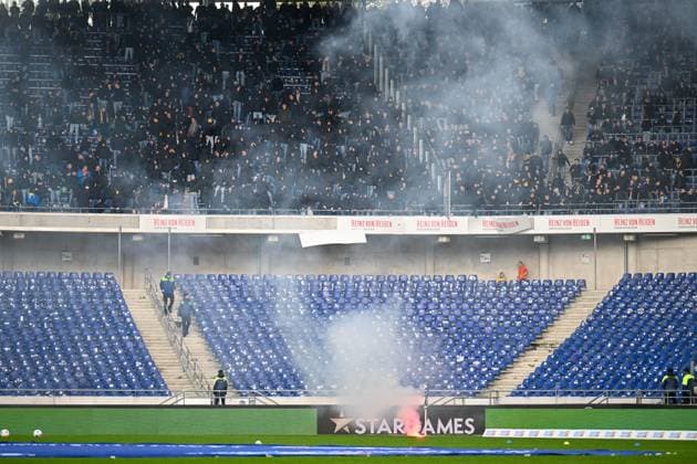 2 Bundesliga Hannover 06 Eintracht Braunschweig on 05 11 2023 at HDI Arena in Hannover Fans Ultras of Braunschweig storm the block and throw down bengal fire and advertising boards MT