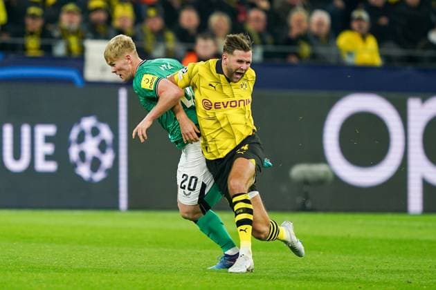 Borussia Dortmund FC v Newcastle United FC Borussia Dortmund forward Niclas Fullkrug (14) battles with Newcastle United defender Lewis Hall (20) during the Borussia Dortmund FC v Newcastle United FC UEFA Champions League Round 1 Group F match at BVB Stadion, Dortmund, Germany on 7 November 2023 Editorial Use Only Copyright: xIMAGO EveryxSecondxMediax ESM-0841-0024