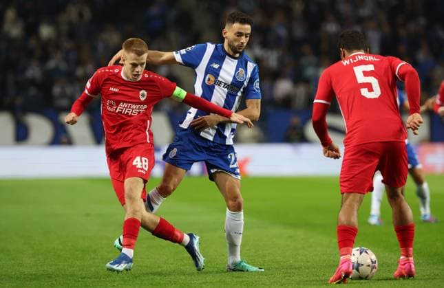 Antwerp s Arthur Vermeeren and Porto s Joao Mario fight for the ball during a game between Portuguese FC Porto and Belgian soccer team Royal Antwerp FC, on Tuesday 07 November 2023, in Porto, Portugal, on day four of the Champions League group stage, in the group H. VIRGINIExLEFOUR  x79481579x