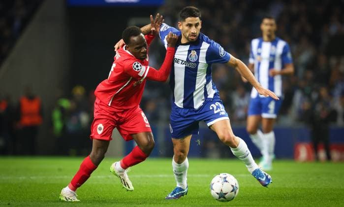 Antwerp s Alhassan Yusuf Abdullahi and Porto s Joao Mario fight for the ball during a game between Portuguese FC Porto and Belgian soccer team Royal Antwerp FC, on Tuesday 07 November 2023, in Porto, Portugal, on day four of the Champions League group stage, in the group H. VIRGINIExLEFOUR  x79482081x