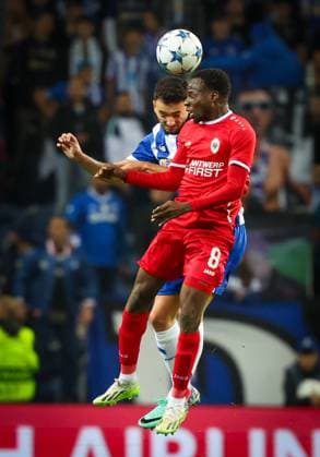 Antwerp s Alhassan Yusuf Abdullahi and Porto s Joao Mario fight for the ball during a game between Portuguese FC Porto and Belgian soccer team Royal Antwerp FC, on Tuesday 07 November 2023, in Porto, Portugal, on day four of the Champions League group stage, in the group H. VIRGINIExLEFOUR  x79482250x