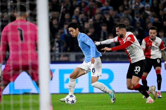 Daichi Kamada of SS Lazio and David Hancko of Feyenoord during the Champions League Group E football match between SS Lazio and Feyenoord at Olimpico stadium in Rome (Italy), November 7th, 2023. andreaxstaccioli