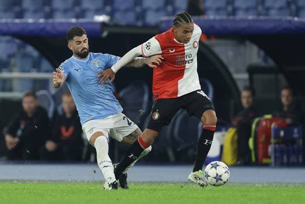 UEFA Champions League SS Lazio vs Feyenoord Rotterdam Lazio s Albanian defender Elseid Hysaj challenges for the ball with Feyenoord s Dutch forward Calvin Stengs during the UEFA Champions League match Group Stage Group E between SS Lazio vs Feyenoord Rotterdam at Olimpico Stadium on November 07, 2023, in Rome. ABPH0454 Copyright: xAntonioxBalascox
