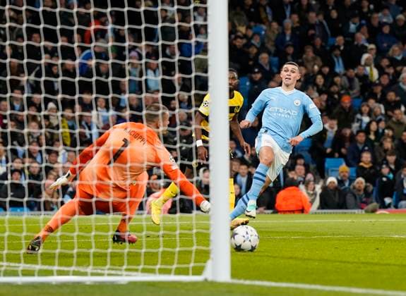 Manchester, England, 7th November 2023. Phil Foden of Manchester City scoring his sides second goal during the UEFA Champions League, Group G match at the Etihad Stadium, Manchester. Picture credit should read: Andrew Yates Sportimage EDITORIAL USE ONLY. No use with unauthorised audio, video, data, fixture lists, club league logos or live services. Online in-match use limited to 120 images, no video emulation. No use in betting, games or single club league player publications. SPI-2717-0046