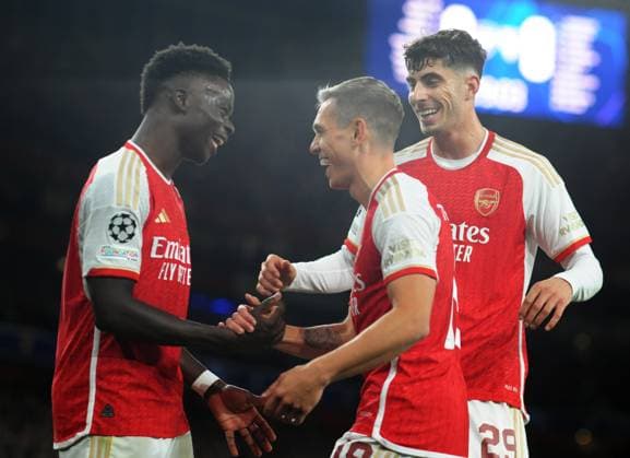 Football - 2023 2024 UEFA Champions League - Group B - Matchday Four Six - Arsenal vs Sevilla - Emirates Stadium - Wednesday 8th November 2023 Leandro Trossard of Arsenal celebrates scoring his first half goal with Bukayo Saka and kai Havertz 