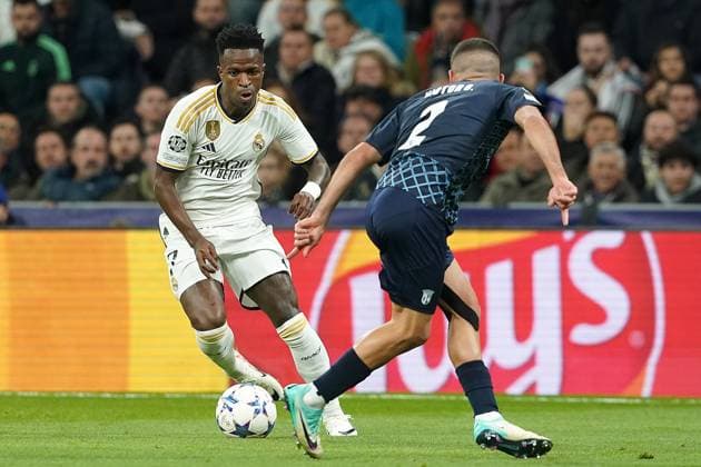 Real Madrid CF s Vinicius Junior (l) and SC Braga s Victor Gomez during Champions League 2023 2024, Group C, match 4. November 8,2023. (2023110841)