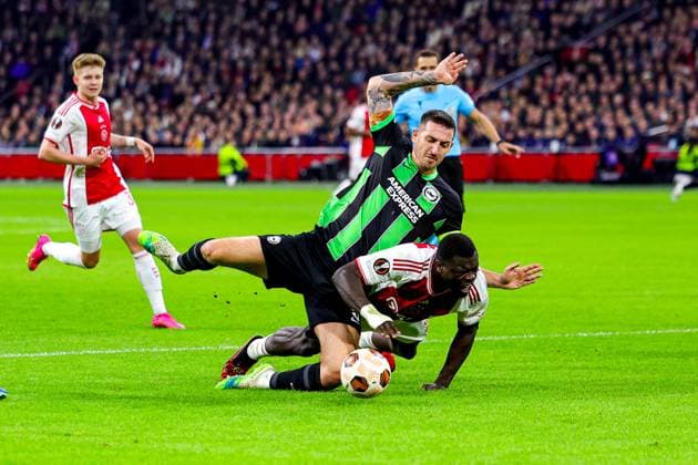 Ajax v Brighton and Hove Albion Europa League 09 11 2023. Lewis Dunk (5) of Brighton & Hove Albion brings down Brian Brobbey (9) of Ajax during the Europa League match between Ajax and Brighton and Hove Albion at the Amsterdam Arena, Amsterdam, Netherlands on 9 November 2023. Editorial use only , Copyright: xNigelxKeenex PSI-18369-0016