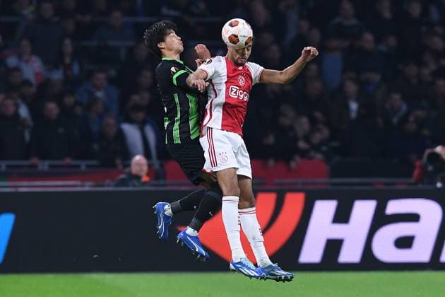 Soccer Europa League group stage matchday 4 Ajax Amsterdam Brighton Hove Albion on 09 11 2023 at the Johan Cruijff ArenA in Amsterdam Kaoru Mitoma Brighton Hove , left Devyne Rensch Amsterdam , right xRx
