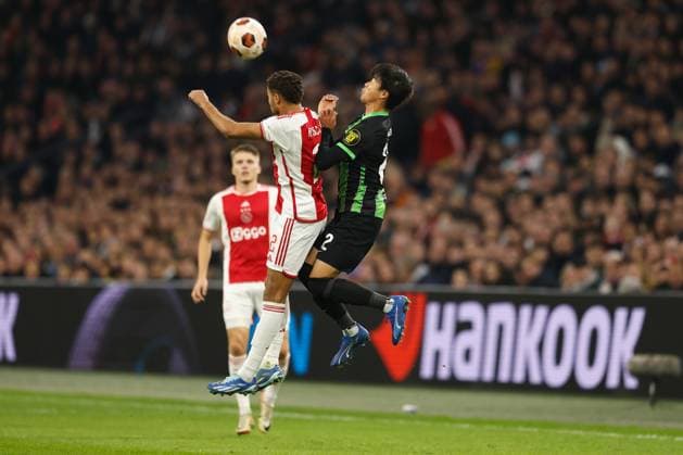 (L-R) Devyne Rensch (Ajax), Kaoru Mitoma (Brighton), NOVEMBER 9, 2023 - Football Soccer : UEFA Europa League group B matchday4 between Sporting AFC Ajax 0-2 Brighton & Hove Albion FC at the Johan Cruijff ArenA in Amsterdam, Netherlands. Noxthirdxpartyxsales  (235180133)