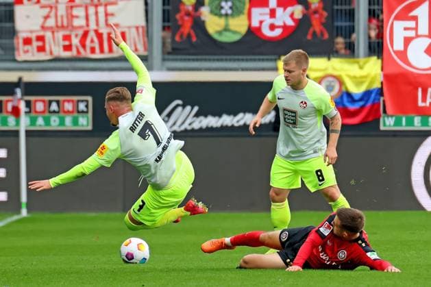 Wiesbaden, Germany 12 November 2023 2 BL 2023 2024 SV Wehen Wiesbaden vs 1 FC Kaiserslautern Pictured from left fighting for the ball Marlon Ritter Kaiserslautern , Jean Zimmer Kaiserslautern and Amar ÄÜatic Wiesbaden DFL regulations prohibit any use of photographs as image sequences and or quasi video Britta Arena Hessen Copyright: xFotostandx xRacochax