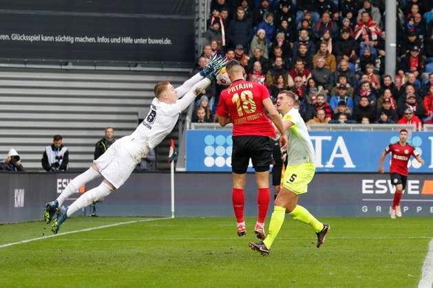 12 11 2023, xavx, Soccer 2 Bundesliga, SV Wehen Wiesbaden 1 FC Kaiserslautern emspor, v l Goalkeeper Julian Krahl 1 FC Kaiserslautern catches the ball in front of Ivan Prtajin SV Wehen Wiesbaden DFL DFB REGULATIONS PROHIBIT ANY USE OF PHOTOGRAPHS as IMAGE SEQUENCES and or QUASI VIDEO Wiesbaden