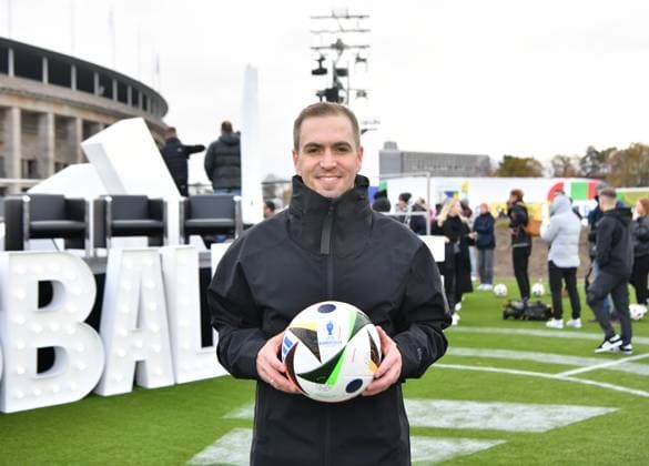 (231115) -- BERLIN, Nov. 15, 2023 -- German former national soccer player Philipp Lahm, shows an official match ball of UEFA EURO, EM, Europameisterschaft,Fussball 2024 during the unveiling event of the official match ball of UEFA EURO 2024 in Berlin, Germany, Nov. 15, 2023. ) (SP)GERMANY-BERLIN-FOOTBALL-EURO 2024-OFFICIAL MATCH BALL-UNVEILING RenxPengfei 