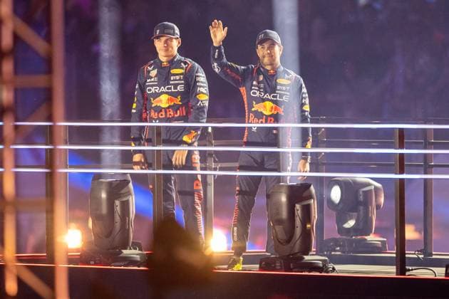 LAS VEGAS, NV - NOVEMBER 15: Red Bull Racing driver Max Verstappen (1) of the Netherlands and Red Bull Racing driver Sergio Perez (11) of Mexico are introduced during the opening ceremony of the F1 Las Vegas Grand Prix on Wednesday, November 15 on the Las Vegas Street Circuit in Las Vegas, NV. (Photo by Bob Kupbens Icon Sportswire) AUTO: NOV 15 F1 Las Vegas Grand Prix EDITORIAL USE ONLY Icon231115032