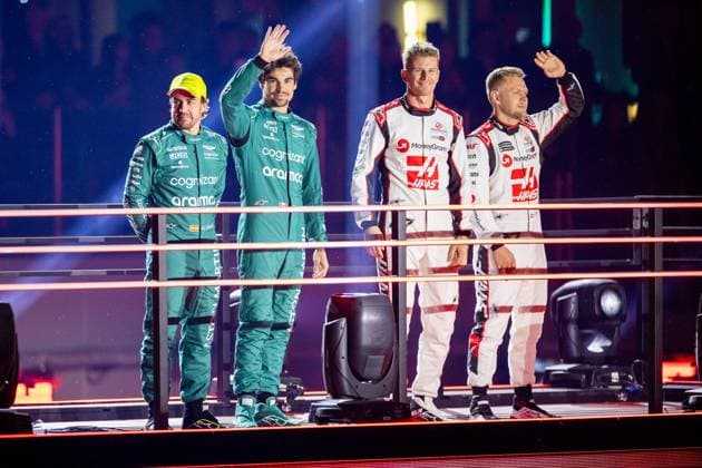 LAS VEGAS, NV - NOVEMBER 15: Aston Martin Racing driver Fernando Alonso (14) of Spain and Aston Martin Racing driver Lance Stroll (18) of Canada stand with Haas F1 Team driver Kevin Magnussen (20) of Denmark and Haas F1 Team driver Nico Hulkenberg (27) of Germany during the opening ceremony of the F1 Las Vegas Grand Prix on Wednesday, November 15 on the Las Vegas Street Circuit in Las Vegas, NV. (Photo by Bob Kupbens Icon Sportswire) AUTO: NOV 15 F1 Las Vegas Grand Prix EDITORIAL USE ONLY Icon231115035